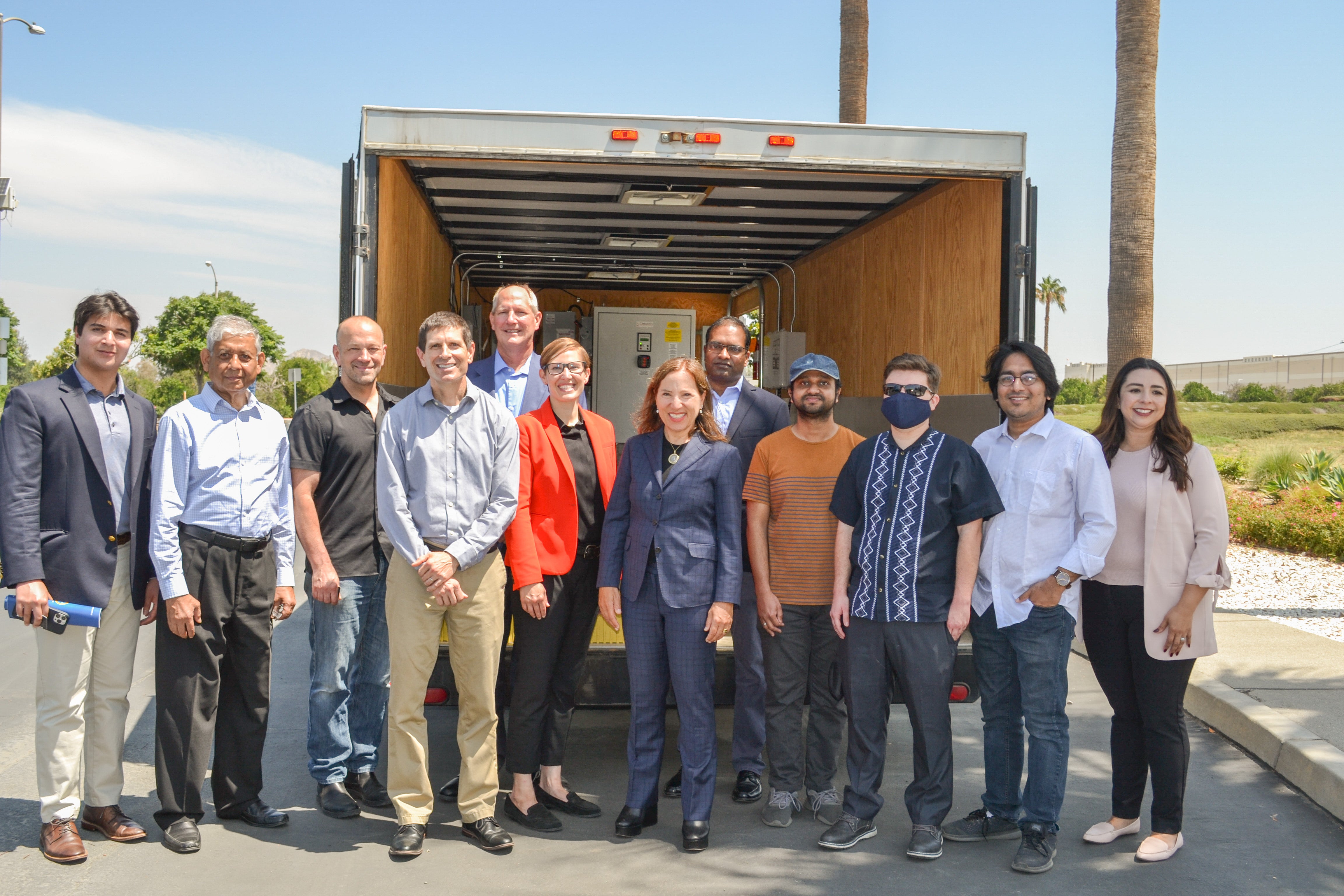 Lt. Governor Kounalakis and CE-CERT researchers in front of SIGI trailer