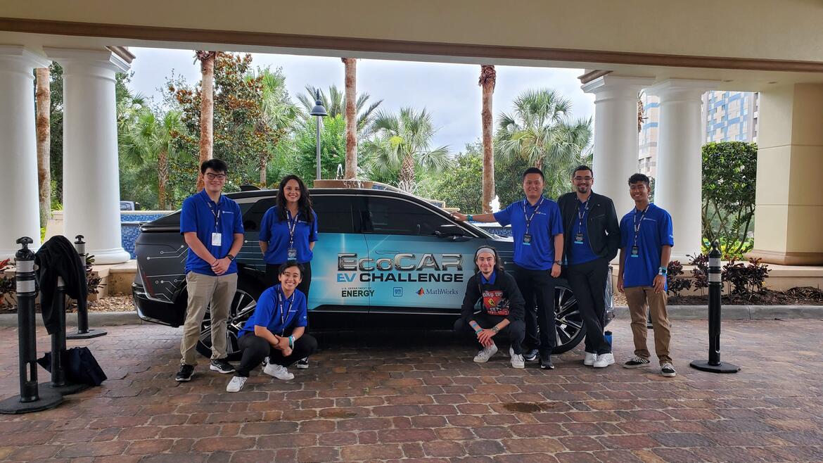 students standing in front of cadillac lyriq