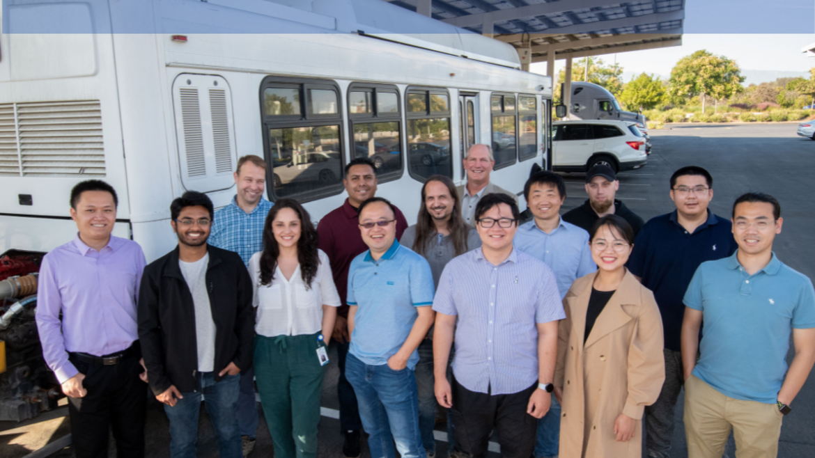 SPEAKS Orientation, students standing in front of CE-CERT sustainable bus