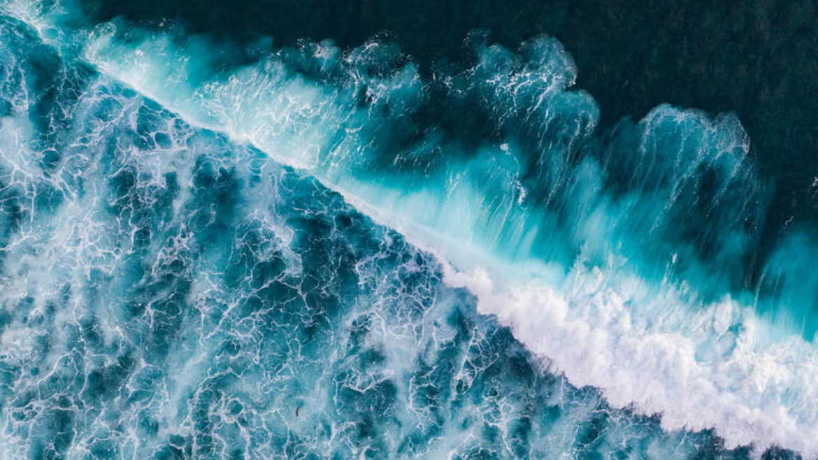 Drone photographs of salty sea water crashing on a beach (Getty Images). 