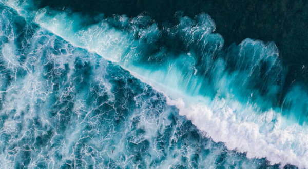 Drone photographs of salty sea water crashing on a beach (Getty Images). 