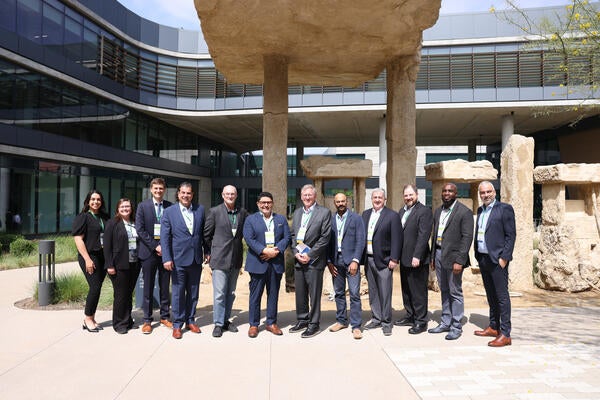 Group photo of the Hydrogen Engine Alliance – North America (H2EA-NA) founding members and leadership, taken at the Inaugural 2025 Hydrogen Engine Conference at CARB in Riverside, California. Representatives from Bosch, Chevron, Cummins, Daimler Truck North America, Forvia, MAHLE, Tenneco, UC Riverside, and University of Michigan stand together outdoors, celebrating the launch of the Alliance.