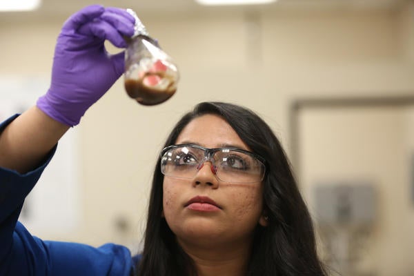student with beaker