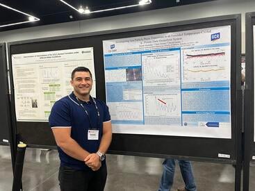 Daniel Gonzalez presenting his research at the poster symposium at AAAR