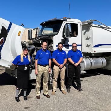 referees standing in front of truck for testing research