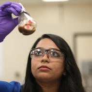 student with beaker student with beaker